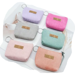 Portamonete in velluto a coste in diversi colori a tinta unita